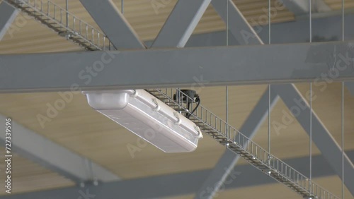 Metal structure of the roof frame in an industrial hangar. Bottom-up view. Close-up.  installation of lighting fixtures suspended ceiling and Lighting equipment photo