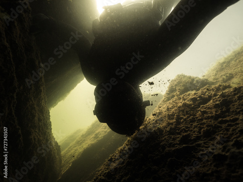 Freediver's head hitting underwater rock