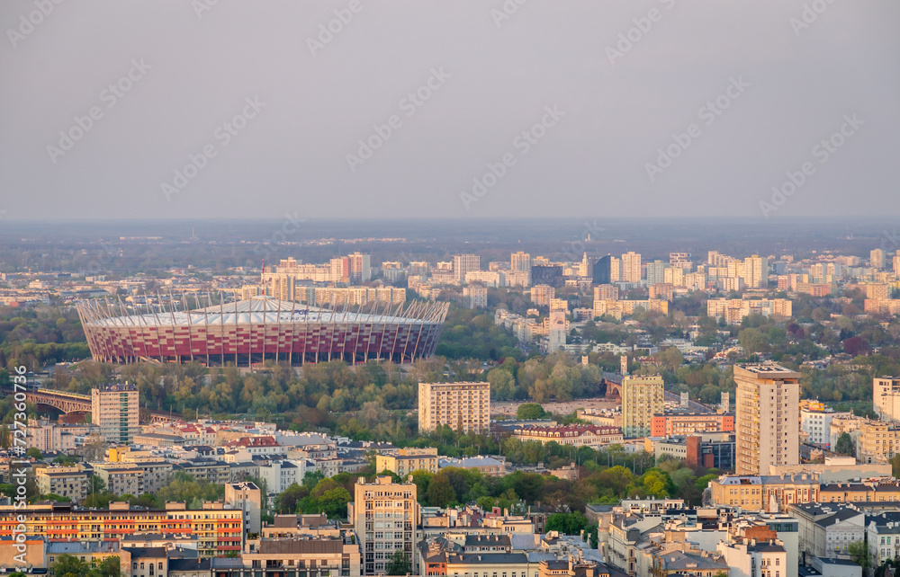 View of Warsaw cityscape with Vistula River, Swietokrzyski Bridge and National Stadium