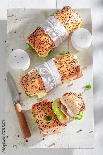 Healthy sandwich with camembert, prosciutto and mayonnaise.