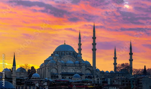 Sunset in Istanbul, Turkey with Suleymaniye Mosque (Ottoman imperial mosque). View from Galata Bridge in Istanbul. TURKEY photo