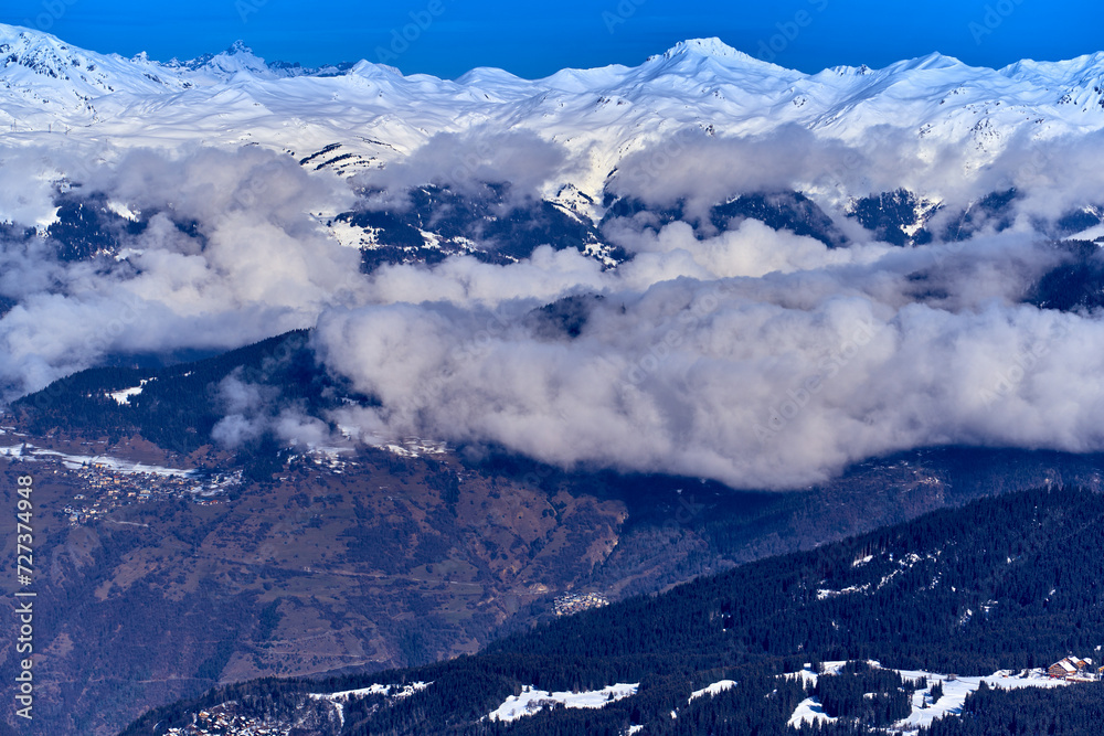 Breathtaking beautiful panoramic view on Snow Alps - snow-capped winter mountain peaks around French Alps mountains, The Three Valleys: Courchevel, Val Thorens, Meribel (Les Trois Vallees), France