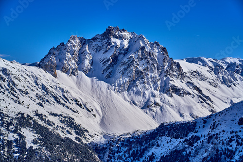 Breathtaking beautiful panoramic view on Snow Alps - snow-capped winter mountain peaks around French Alps mountains  The Three Valleys  Courchevel  Val Thorens  Meribel  Les Trois Vallees   France