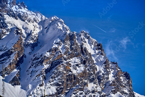 Breathtaking beautiful panoramic view on Snow Alps - snow-capped winter mountain peaks around French Alps mountains, The Three Valleys: Courchevel, Val Thorens, Meribel (Les Trois Vallees), France photo