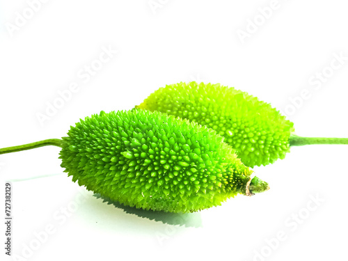 Spiny gourd or spine gourd also known as bristly balsma pear, prickly carolaho isolated on white background. photo