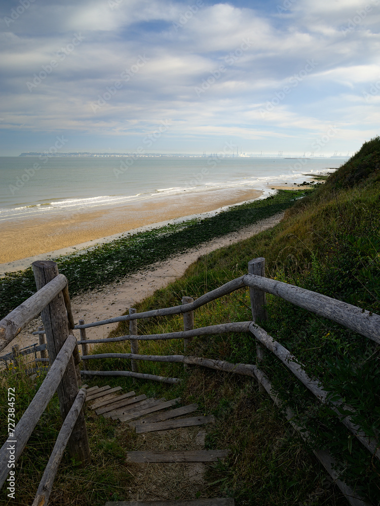 path with wooden border going down to Villerville beach in Normandy