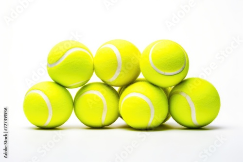 A pile of tennis balls neatly stacked on top of each other, creating a playful and vibrant display, Tennis balls on rackets in different positions, white background, AI Generated © Iftikhar alam