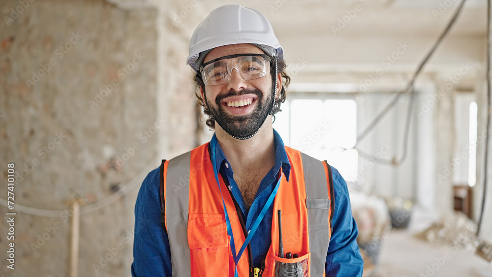 Young hispanic man architect smiling confident standing at construction site Young hispanic man architect smiling confident standing at construction site