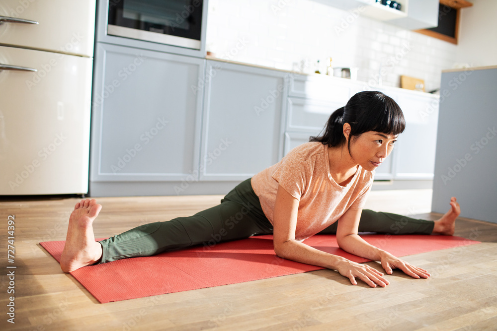 Young asian woman doing yoga at home Young asian woman doing yoga at home