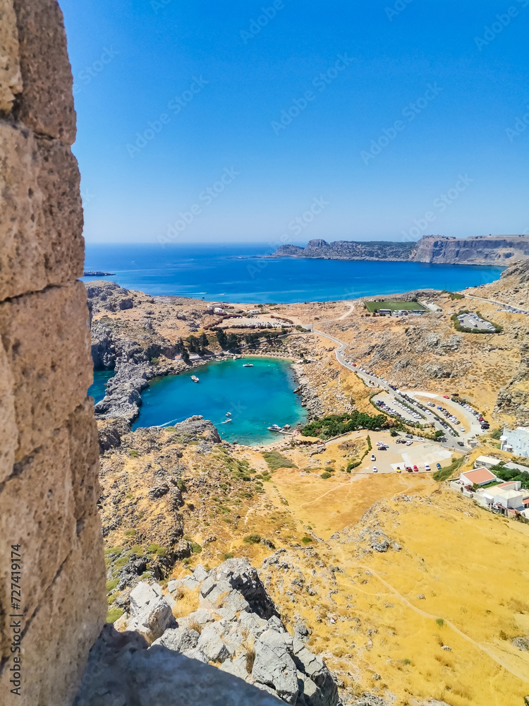 View of St. Paul's Bay in Lindos. Rocks surround the sea in the shape of a heart
