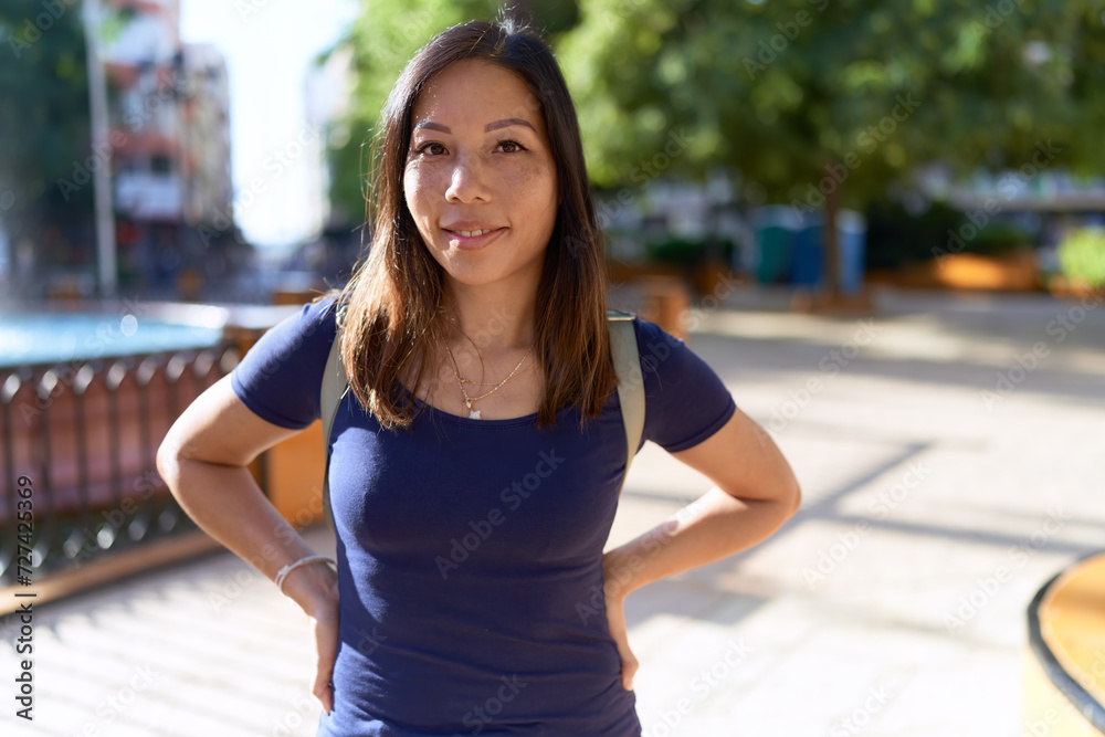 Young asian woman smiling confident standing at park