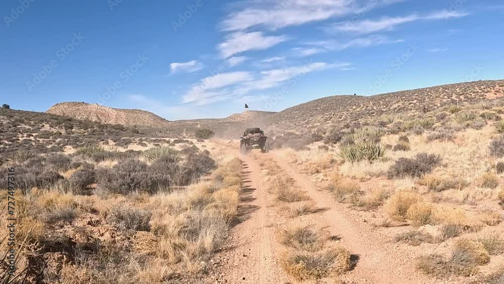 Off road recreation desert trail Arizona POV. Off road trail riding in 4x4 all terrain vehicle for sport recreation. Utah and Arizona landscape. Grass lands, rocky terrain and mountain valley. Off road recreation desert trail Arizona POV. Off road trail riding in 4x4 all terrain vehicle for sport recreation. Utah and Arizona landscape. Grass lands, rocky terrain and mountain valley.