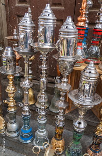 hookahs, shishas, or waterpipes for sale on busy Moez Street in Fatimid or Medieval Cairo, Egypt 
 photo