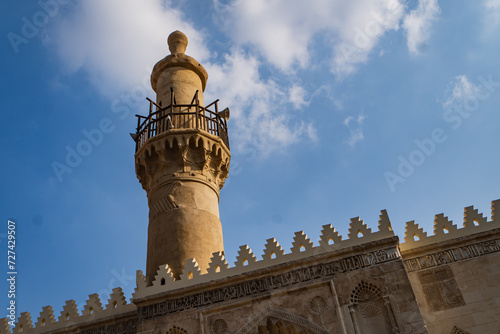 ancient minaret at al-Aqmar Mosque on Moez Street in Fatamid or Medieval Cairo, Egypt 
 photo