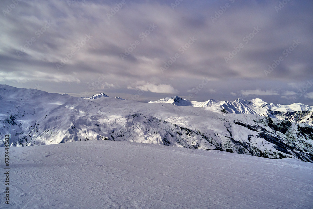Breathtaking beautiful panoramic view on Snow Alps - snow-capped winter mountain peaks around French Alps mountains, The Three Valleys: Courchevel, Val Thorens, Meribel (Les Trois Vallees), France