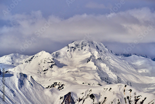 Breathtaking beautiful panoramic view on Snow Alps - snow-capped winter mountain peaks around French Alps mountains, The Three Valleys: Courchevel, Val Thorens, Meribel (Les Trois Vallees), France photo