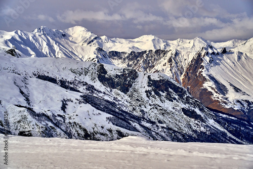 Breathtaking beautiful panoramic view on Snow Alps - snow-capped winter mountain peaks around French Alps mountains, The Three Valleys: Courchevel, Val Thorens, Meribel (Les Trois Vallees), France photo