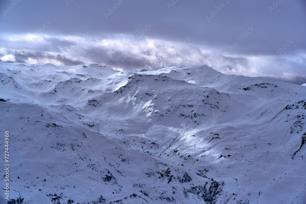 Breathtaking beautiful panoramic view on Snow Alps - snow-capped winter mountain peaks around French Alps mountains, The Three Valleys: Courchevel, Val Thorens, Meribel (Les Trois Vallees), France