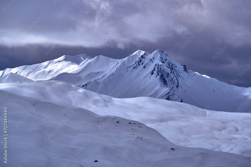 Breathtaking beautiful panoramic view on Snow Alps - snow-capped winter mountain peaks around French Alps mountains, The Three Valleys: Courchevel, Val Thorens, Meribel (Les Trois Vallees), France