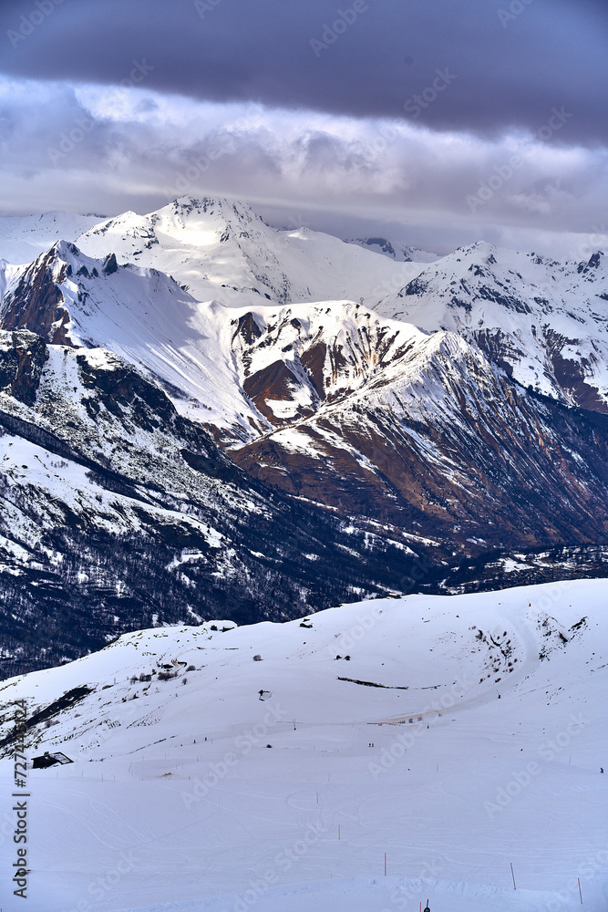 Breathtaking beautiful panoramic view on Snow Alps - snow-capped winter mountain peaks around French Alps mountains, The Three Valleys: Courchevel, Val Thorens, Meribel (Les Trois Vallees), France