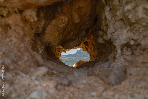 View from El Castell de Guadelest, Alicante, Spain through a hole in the rocks.