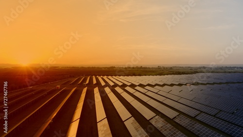 Drone view of solar panels in sunset time