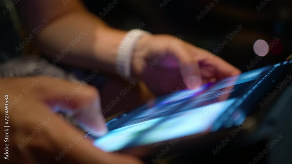 Closeup male hands searching on tablet screen, browsing videos or image content using WiFi at night. Close view modern tech device bright screen. Young man scrolling content online, wireless internet Closeup male hands searching on tablet screen, browsing videos or image content using WiFi at night. Close view modern tech device bright screen. Young man scrolling content online, wireless internet
