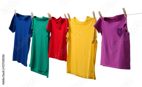 Colorful t-shirts drying on washing line isolated on white