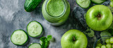 Green smoothie with cucumber and green apple. Green smoothie in jar, overhead on glass, healthy drink, top view, copy space	