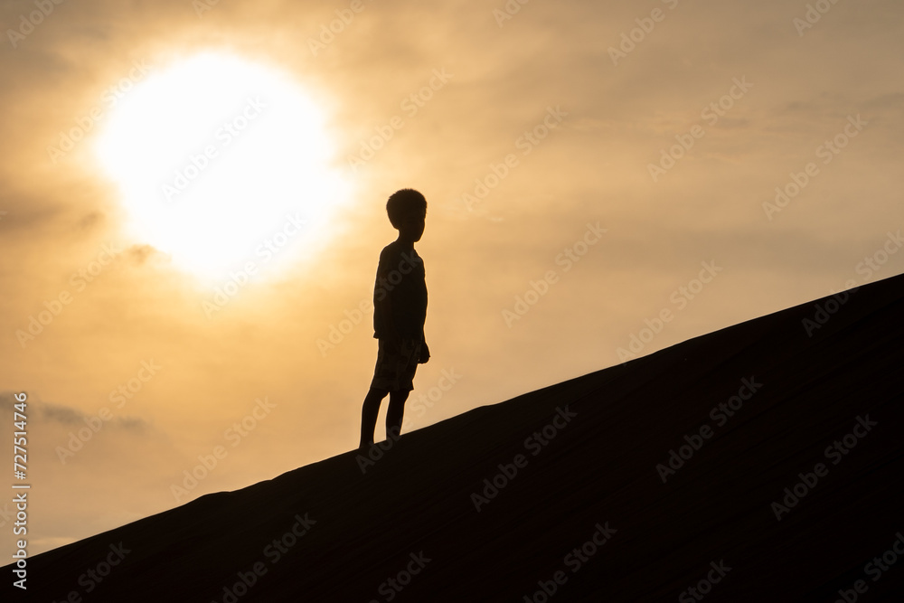 silhouette of boy