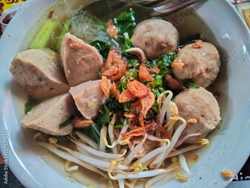 Indonesian street food. Bakso with bean sprouts, vermicelli and a sprinkling of fried onions.