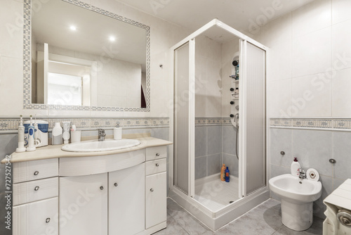 Bathroom with white furniture  square shower cabin