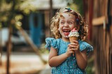 Happy little girl holding an ice-cream in her hand.