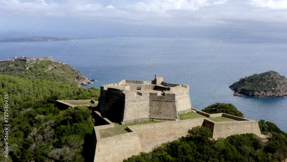 aerial view of a stronghold near the sea in tuscany aerial view of a stronghold near the sea in tuscany