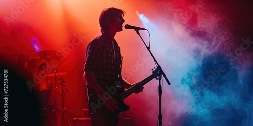 Rock band performing on stage music concept with lighting and smoke