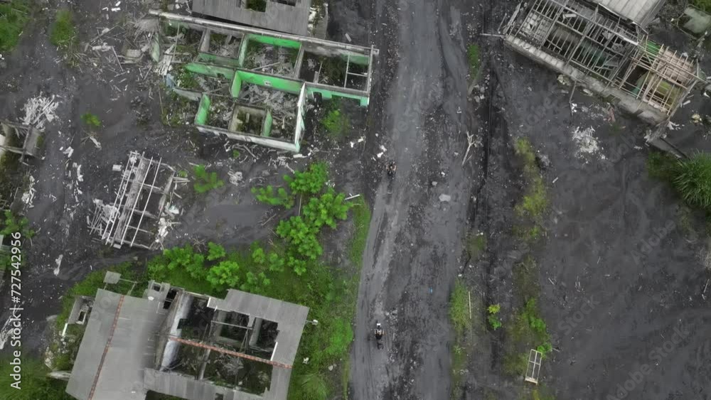 Motorcyclists ride through village destroyed in 2021 by volcanic ash Motorcyclists ride through village destroyed in 2021 by volcanic ash