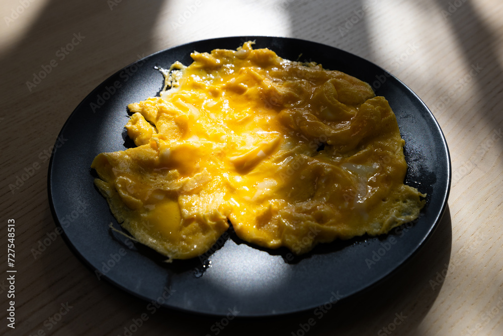 A plate of scramble eggs. A plate of scramble eggs.