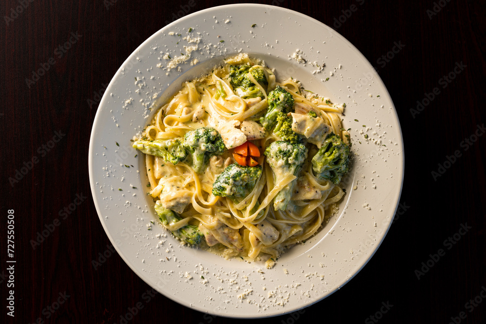 Chicken and broccoli Alfredo over pasta 