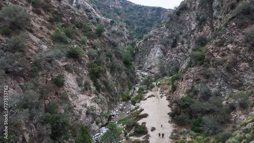 eaton canyon in Pasadena california in angeles national forest on an overcast day with hikers in the canyon AERIAL PAN 60fps photo