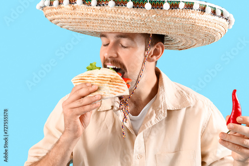 Young Mexican man in sombre...