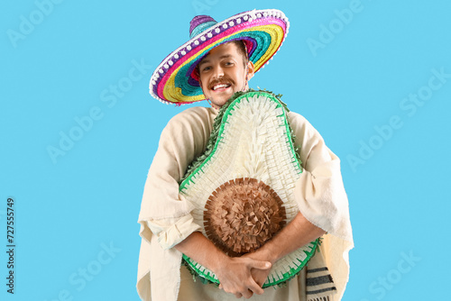 Young Mexican man in sombre...