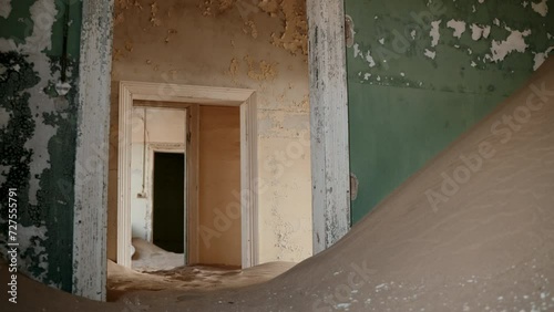 Colorful empty hallways filled with desert sand.