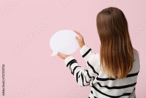 Pretty young woman holding ...