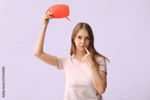 Thoughtful young woman hold...