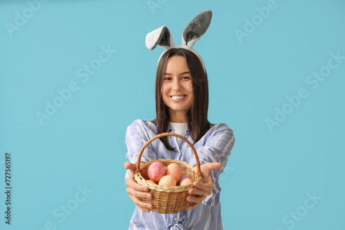 Smiling young woman wearing...