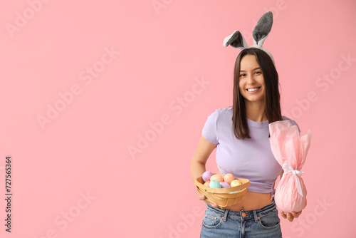 Smiling young woman wearing...