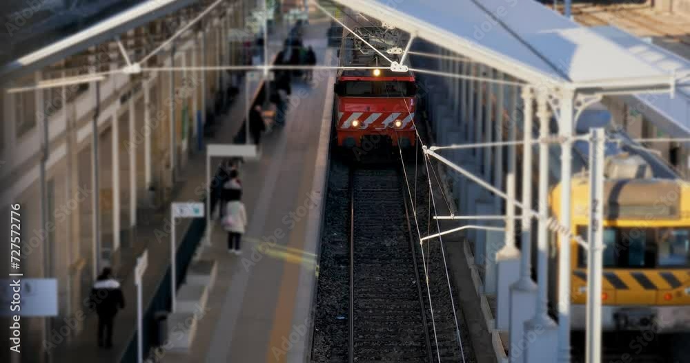 Train arriving at the train station - tilt shift Train arriving at the train station - tilt shift