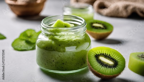 A jar of kiwi spread with a kiwi slice on top