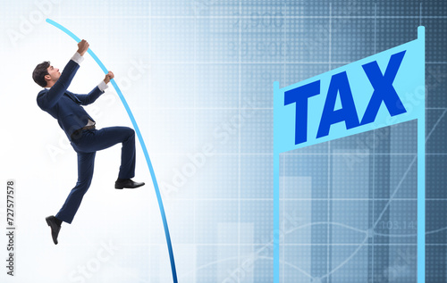 Photography The businessman jumping over tax in tax evasion avoidance concep