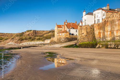 Robin Hood's Bay, the sea wall and village, North Yorkshire, from the foreshore on a spring morning.
 photo